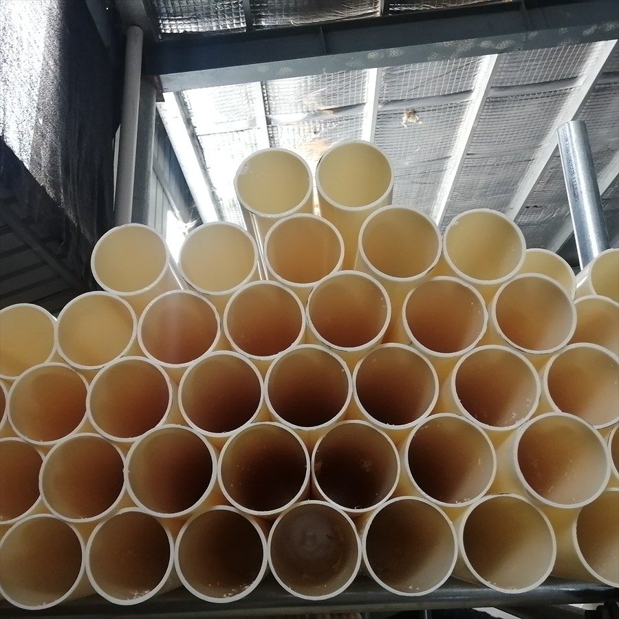 Stacked ABS pipe ends photographed from below