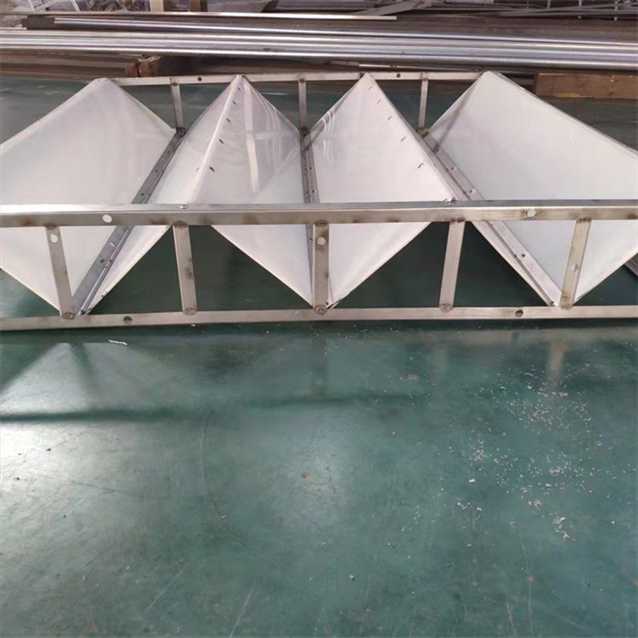 Close view of V-shaped folded plates in a frame