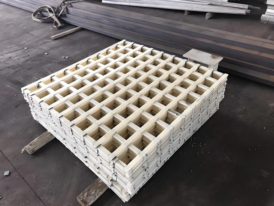 White flocculation grid modules stacked in the factory yard