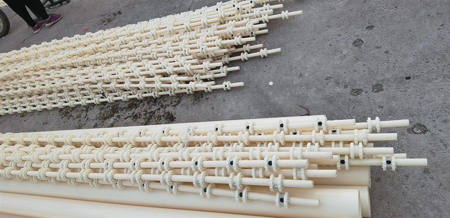 Rows of aerator pipe assemblies on a warehouse floor