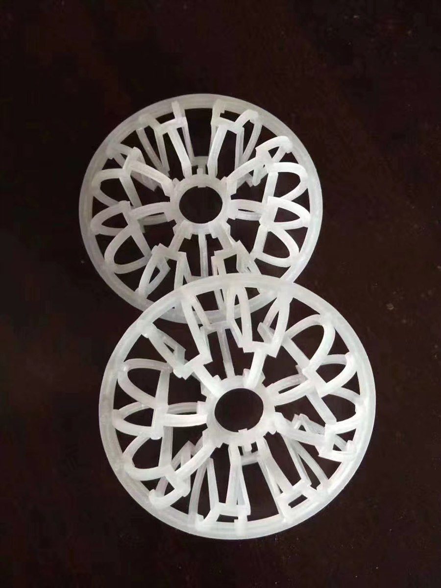 Two milky-white rosette rings on a dark brown surface