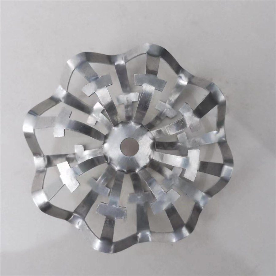 Single stainless steel rosette ring on a light grey background