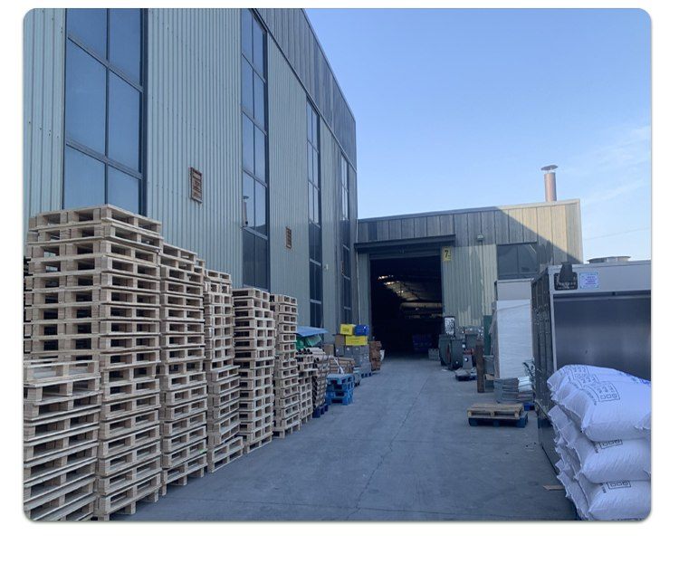 Factory yard with packed pallets of aerator units staged for shipment